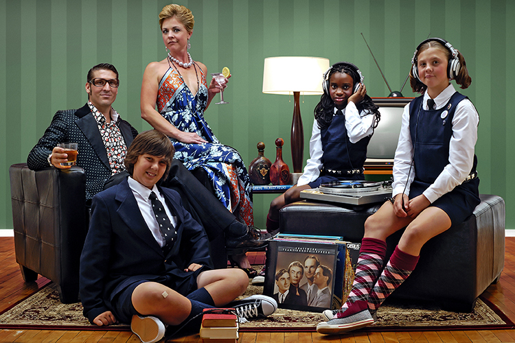 A stylized family portrait shows an elegantly dressed couple sitting on armchairs. Two girls in school uniforms are enjoying music on headphones, and a boy lounges with books. A vintage TV and vinyl records are featured in the scene.